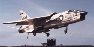 F-8J Crusader of VF-191 lands onboard the USS Oriskany. Note the raised wing which reduces landing speeds. (US Navy)